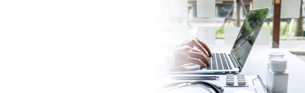 Female doctor working on a computer 