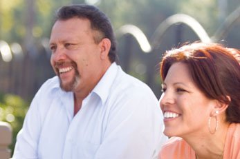 Couple smiling outside