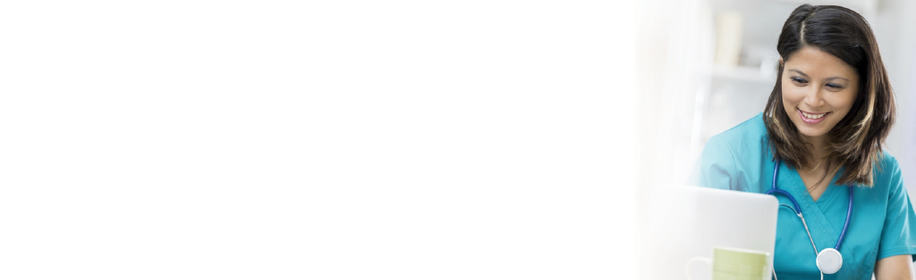 female medical professional reading laptop