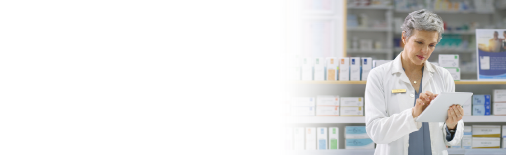 provider smiling and working on laptop