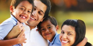 man woman children smiling