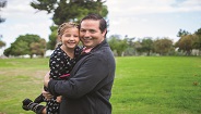 Father holding young child