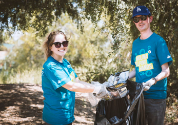 volunteers cleaning up litter in the woods