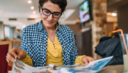 woman reading newsletter