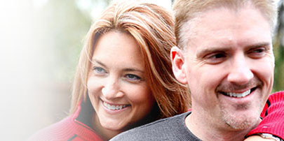 Couple smiling outside