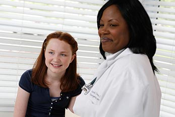 Doctor and patient smiling
